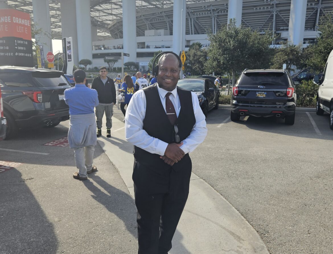 Los Angeles Rams at SoFi Stadium Private Car and Limo Service. Owner/Ceo Patrick W Paige standing in the Orange Zone Lot E
