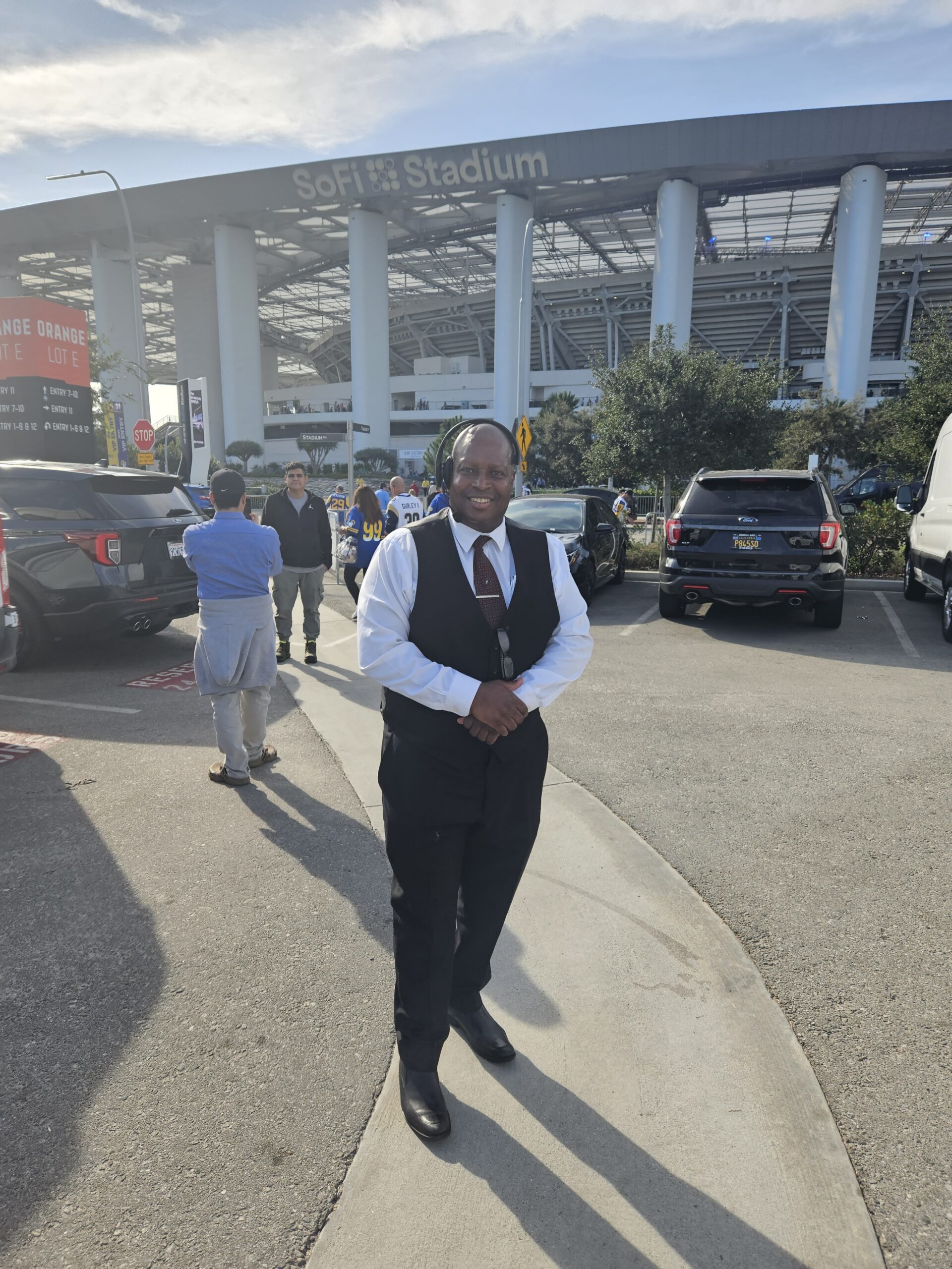Los Angeles Rams at SoFi Stadium Private Car and Limo Service. Owner/Ceo Patrick W Paige standing in the Orange Zone Lot E